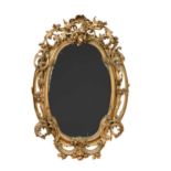 An oval Victorian gilt and gesso wall mirror,