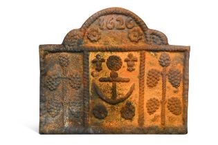 A cast iron fire back bearing date '1626',