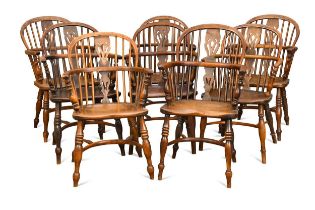 Eight yew and elm stick back armchairs, early 19th century,