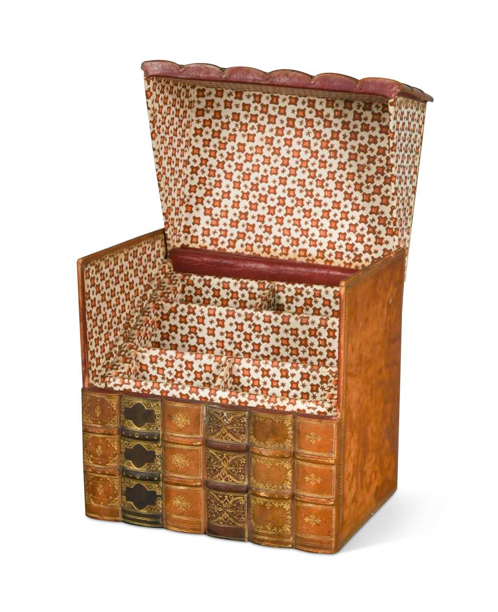 A leather stationery box in the form of a group of six gilt tooled leather-bound books,