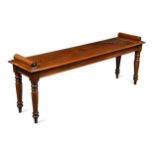 A Victorian mahogany window seat,