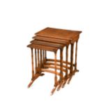A Regency style nest of walnut quartetto tables,