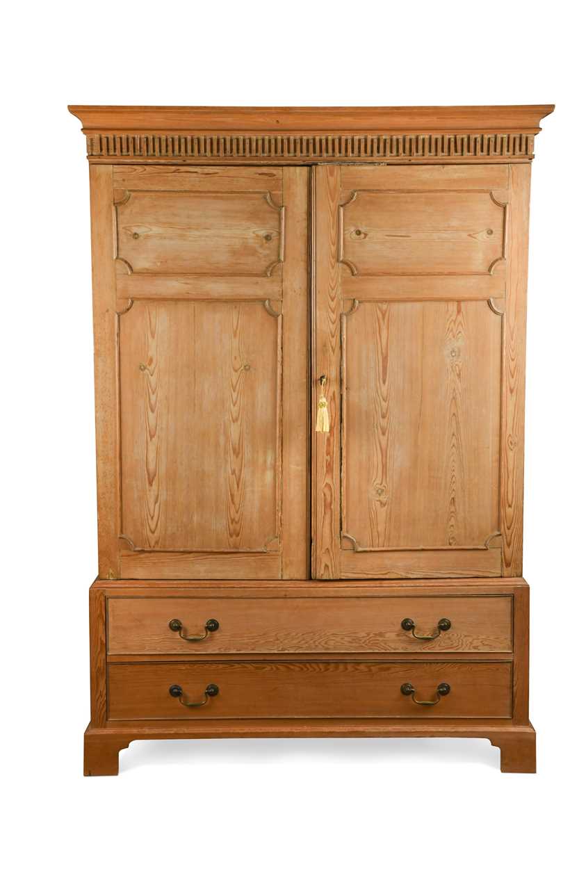 A George III style pine wardrobe, 20th century,