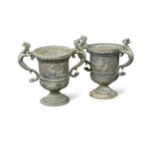 A pair of Georgian two handled lead urns,