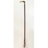A horn and silver gilt collared riding crop,