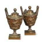 A pair of bronze urns and covers, late 19th century,