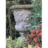 A Haddonstone composition vine decorated garden urn, 20th century,
