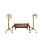 A pair of brass fire dogs and a cast iron basket fire grate, 19th century,