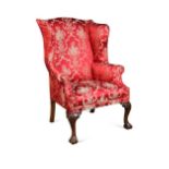 A George II style mahogany wing back armchair, 19th century,