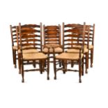 A set of eight oak George III style ladder back chairs, 20th century,