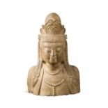 A Chinese carved limestone bust of Avalokitesvara in Sui style,
