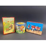 A Blue Bird Confectionery tin decorated with stylised children playing cowboys and indians, a