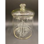 A Smith's Potato Crisps glass lidded dispensing jar, approximately 7" diameter.