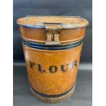 A large and early toleware shop dispensing 'Flour' bin, 20 1/2" h, 16" diameter.