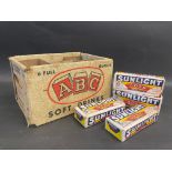 An ABC Soft Drinks six division cardboard crate, plus four unopened packets of Sunlight Soap.