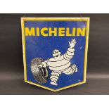 A Michelin pictorial aluminium advertising sign depicting Mr Bibendum rolling a tyre, dated 1970, 13