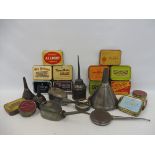 A selection of assorted tins, plus a selection of oilers and funnels etc.