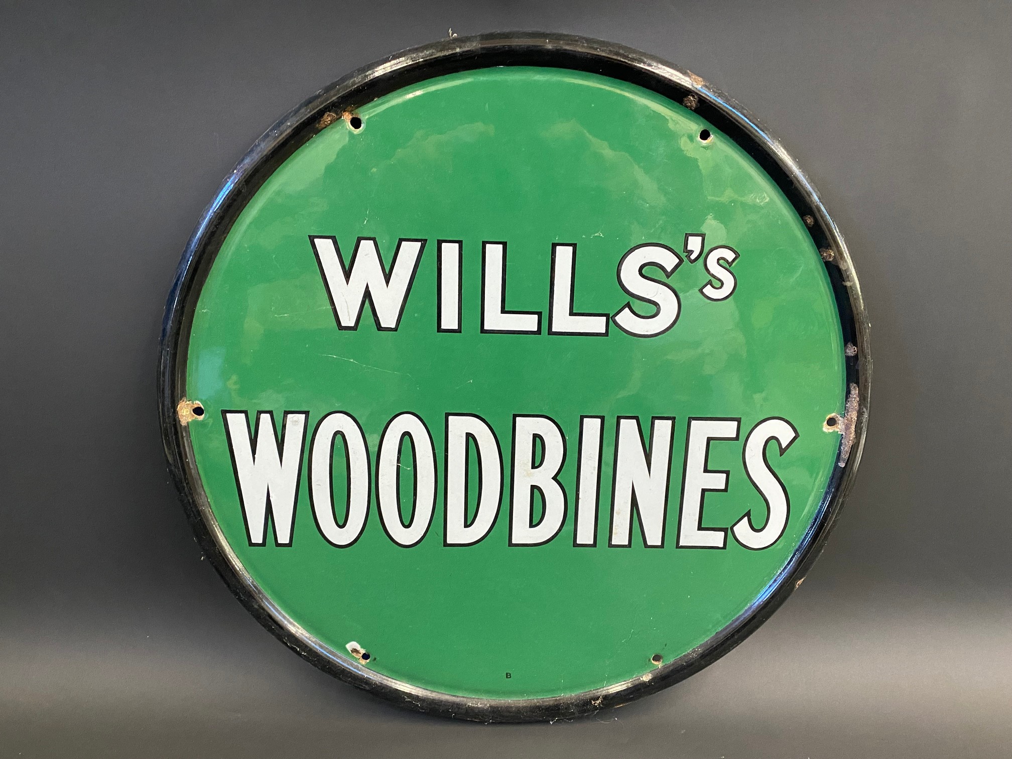 A Wills's Woodbines circular enamel sign in good condition, with a nice gloss, 18" diameter.