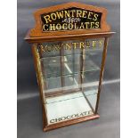 A Rowntree's Chocolates glass and mahogany counter top rear opening dispensing cabinet, with glass