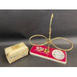 A rare J.& G. Cockburn Tea and Coffee Merchants porcelain counter top display stand, with brass