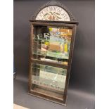 A Fry's Chocolate front opening wall mounted display cabinet, with faintly stamped door and milk