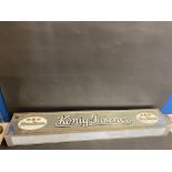 A rectangular illuminated lightbox advertising Konig-Pilsener, 49" w x 8" h x 5" d.