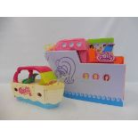 Three large scale Polly Pocket accessory carry cases in the form of boats.