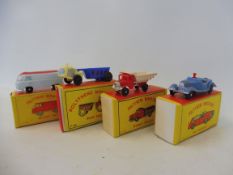 Four boxed Made in Hong Kong early polythene miniatures, an MG roadster, two dump trucks (