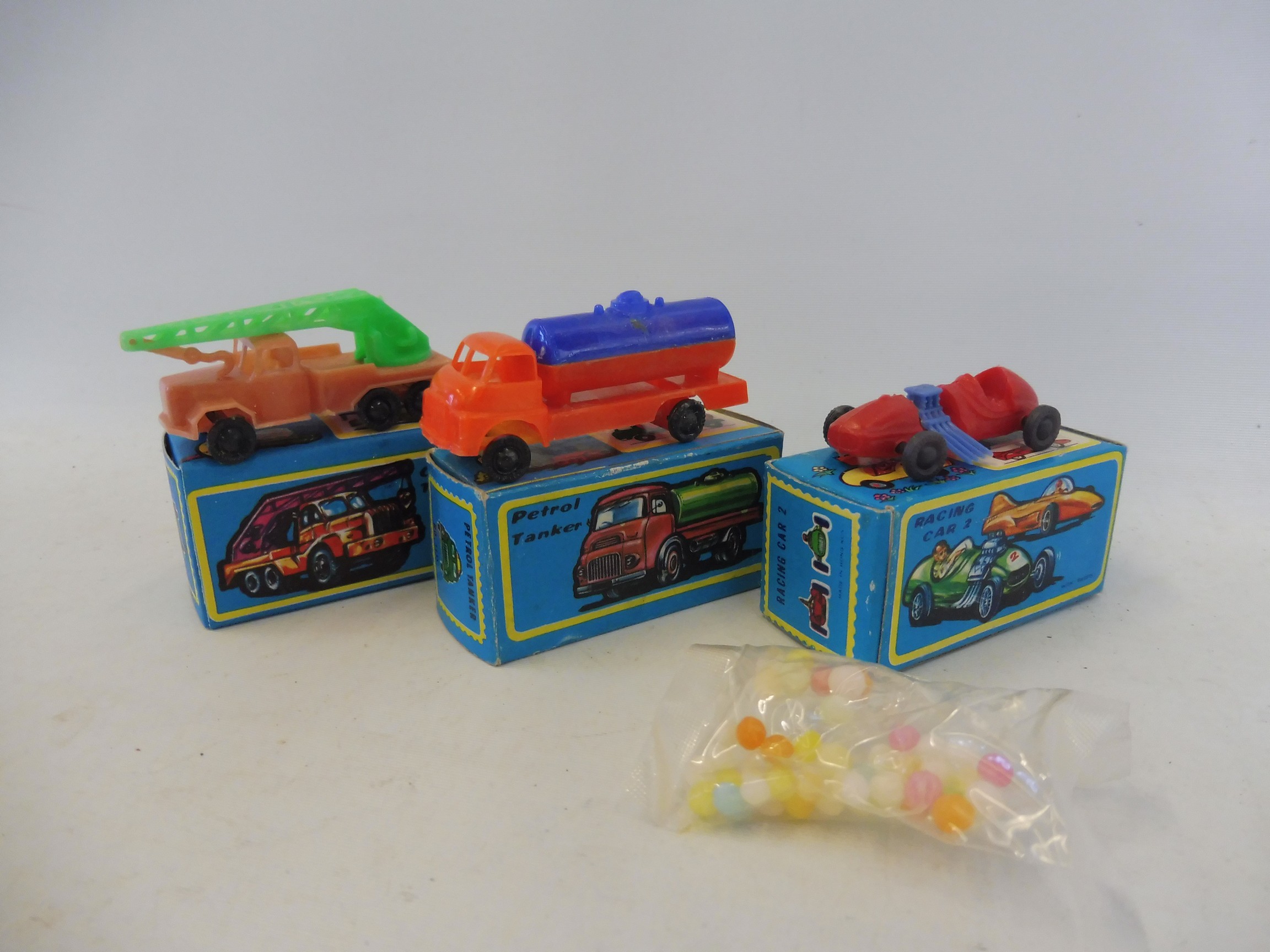 Rosor Novelties - three boxed models, a petrol tanker, a crane truck and a racing car.