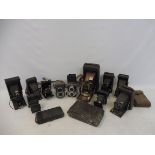 A collection of fold-out cameras including Kodak, also a Halina Anastigmat and a Rolleiflex by