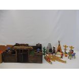 A collection of Playmobil style wild west figures with a fort.
