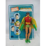 An original Mego Robin carded figure, complete with gauntlets, belt and badge.