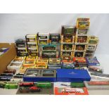 Four boxes of mixed die-cast models including small scale Burago, also some reference books.