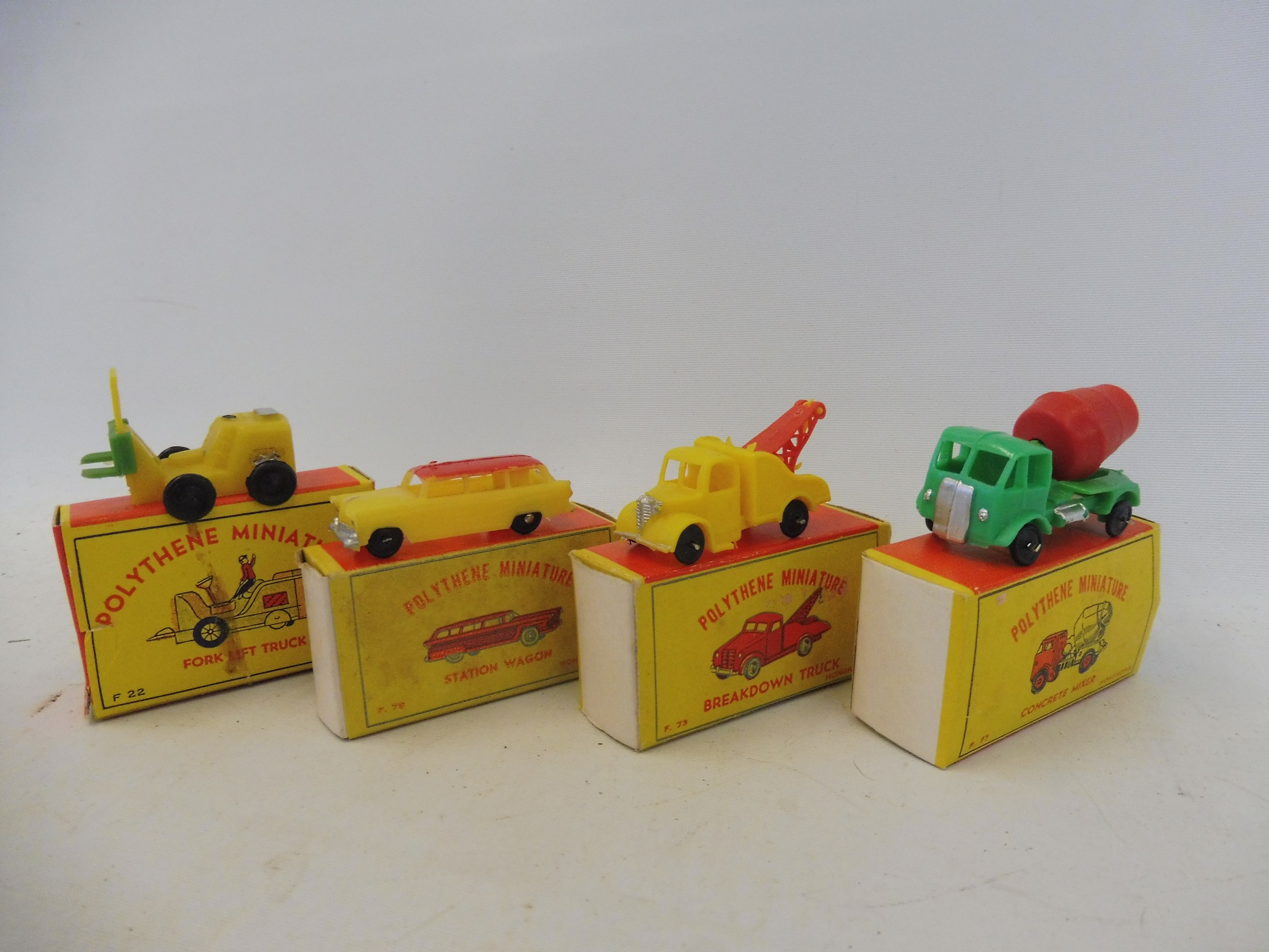 Four boxed Made in Hong Kong early polythene miniatures, a concrete mixer, a breakdown truck, a