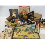 A mixed lot of board games, period cameras, tins etc.