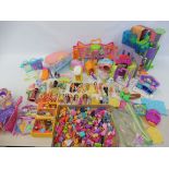 A large quantity of later Polly Pocket playsets, accessories and figures (2 trays).