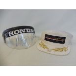 A Honda Formula One team visor, signed in pen by Nelson Piquet and a Honda F1 Racing Team cap,