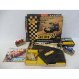 A circa 1960s Tri-ang Scalextric race car set, two boxed slot cars etc.