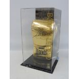 A signed boxing glove in perspex presentation case marked Boxing Legends, signed by Anthony Joshua.