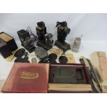 A box of early projectors including Pathescope, Baby Projector, cased Minicine etc.