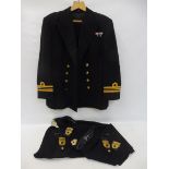 A Royal Navy officer's uniform with a Kangol beret.