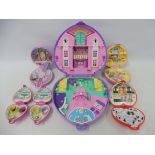 Six heart-shaped Bluebird Swindon England Polly Pocket playsets.