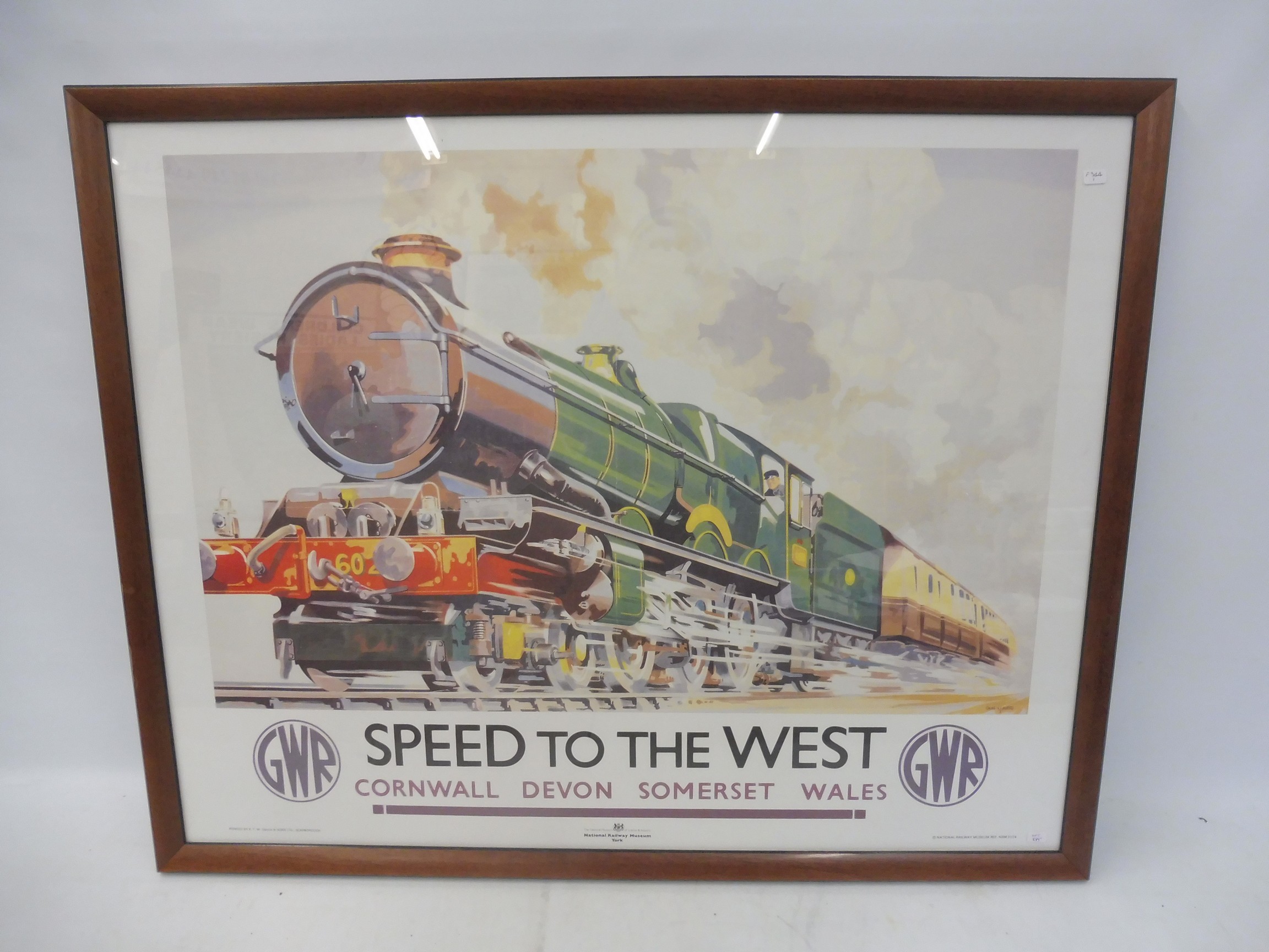 A National Railway Museum print of a GWR poster 'Speed to the West'.