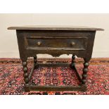 A primitive 17th Century Welsh oak side table with bobbin supports, 30 1/2" w x 26" h x 23" d.
