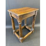 An 18th Century oak joined stool, 17 1/2" w x 22" h x 11 3/4" d.