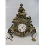 A Rococco style French brass mantle clock.