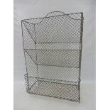 A floor standing wire mesh vegetable rack, 20" w x 32" h x 10" d.