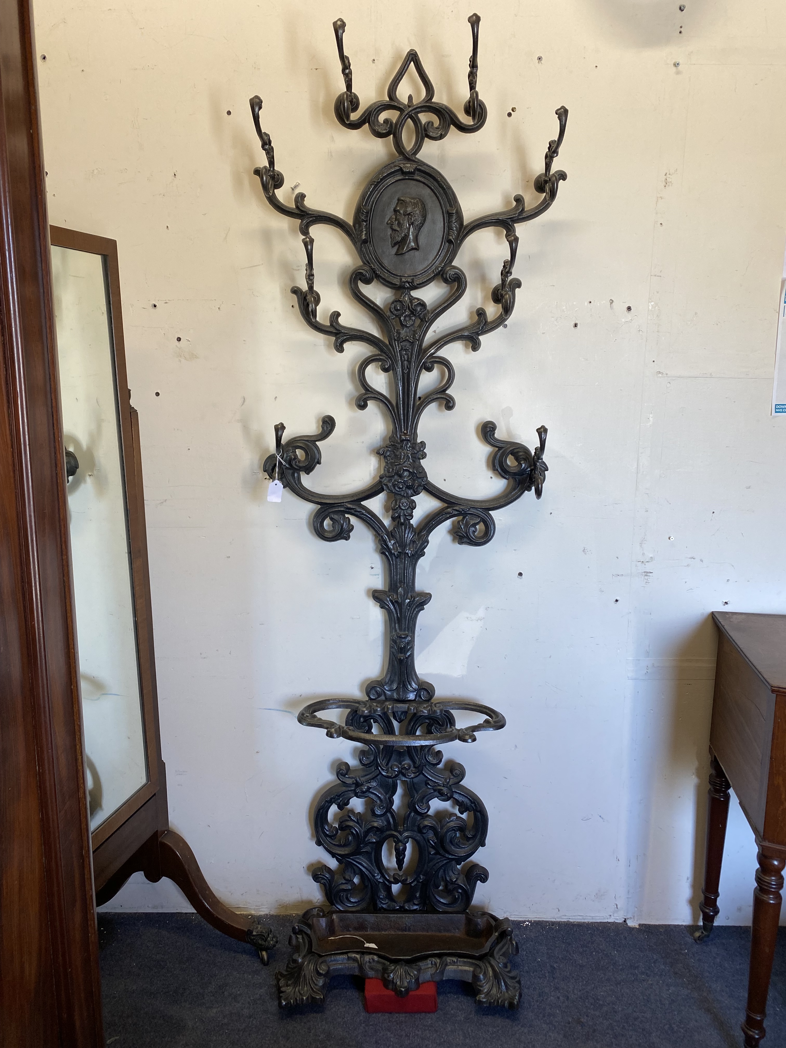 A good quality late 19th Century French iron hat and coat stand of ornate form.