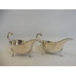 A pair of silver sauceboats raised upon hoof supports, Sheffield 1930.