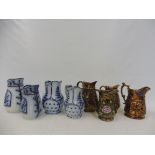 A selection of 19th Century jugs including copper lustre and flow blue.